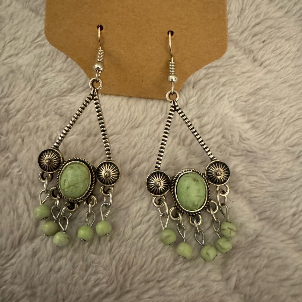 Silver with green stones